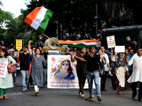 Members of the West Bengal Junior and Senior Doctors' Front march along a street during a protest condemning the rape and murder of a traine...