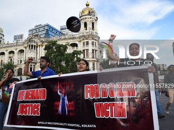 Members of the West Bengal Junior and Senior Doctors' Front march along a street during a protest condemning the rape and murder of a traine...