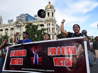 Members of the West Bengal Junior and Senior Doctors' Front march along a street during a protest condemning the rape and murder of a traine...