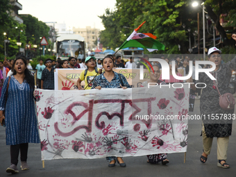 Citizens march along a street during a protest condemning the rape and murder of a trainee medic at a government-run hospital in Kolkata, In...