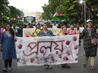 Citizens march along a street during a protest condemning the rape and murder of a trainee medic at a government-run hospital in Kolkata, In...