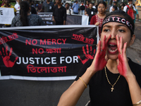 Citizens march along a street during a protest condemning the rape and murder of a trainee medic at a government-run hospital in Kolkata, In...