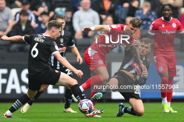 Lewis Macari of Notts County and Jack Hinchy of Notts County battle with Tyler Walton of Accrington Stanley during the Sky Bet League 2 matc...