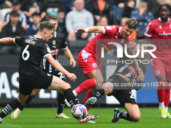 Lewis Macari of Notts County and Jack Hinchy of Notts County battle with Tyler Walton of Accrington Stanley during the Sky Bet League 2 matc...