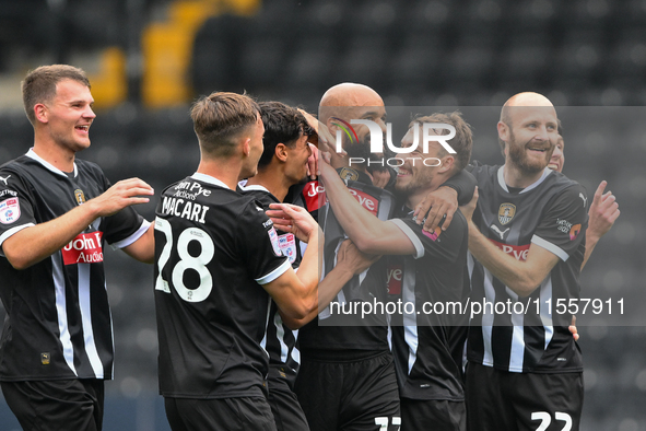 David McGoldrick of Notts County celebrates with teammates after scoring a goal to make it 1-0 during the Sky Bet League 2 match between Not...