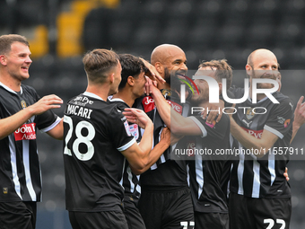 David McGoldrick of Notts County celebrates with teammates after scoring a goal to make it 1-0 during the Sky Bet League 2 match between Not...