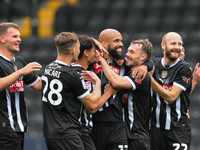 David McGoldrick of Notts County celebrates with teammates after scoring a goal to make it 1-0 during the Sky Bet League 2 match between Not...