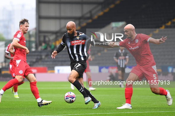 David McGoldrick of Notts County is under pressure from Farrend Rawson of Accrington Stanley during the Sky Bet League 2 match between Notts...