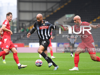 David McGoldrick of Notts County is under pressure from Farrend Rawson of Accrington Stanley during the Sky Bet League 2 match between Notts...