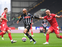 David McGoldrick of Notts County is under pressure from Farrend Rawson of Accrington Stanley during the Sky Bet League 2 match between Notts...