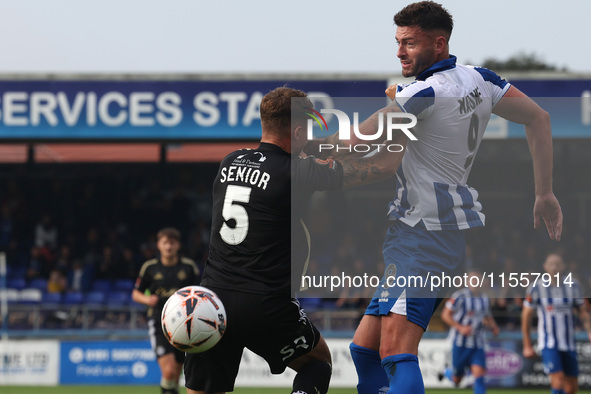 Gary Nadine of Hartlepool United challenges for a header with Adam Senior of FC Halifax Town during the Vanarama National League match betwe...