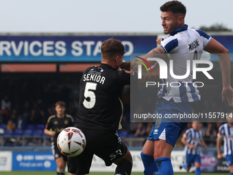 Gary Nadine of Hartlepool United challenges for a header with Adam Senior of FC Halifax Town during the Vanarama National League match betwe...