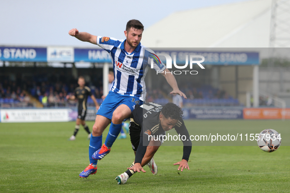 Nathan Sheron of Hartlepool United challenges Angelo Capello of FC Halifax Town during the Vanarama National League match between Hartlepool...