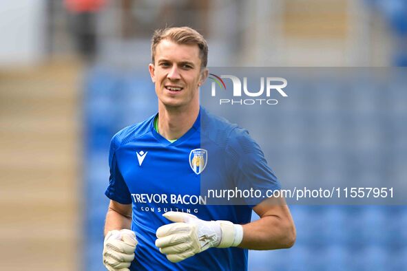 Goalkeeper Matt Macey of Colchester United warms up during the Sky Bet League 2 match between Colchester United and Bromley at the Weston Ho...