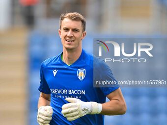 Goalkeeper Matt Macey of Colchester United warms up during the Sky Bet League 2 match between Colchester United and Bromley at the Weston Ho...