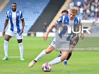 Harry Anderson (7 Colchester United) is challenged by Corey Whitely (18 Bromley) during the Sky Bet League 2 match between Colchester United...