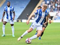 Harry Anderson (7 Colchester United) is challenged by Corey Whitely (18 Bromley) during the Sky Bet League 2 match between Colchester United...