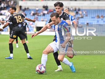 Jack Payne (10 Colchester United) is challenged by Besart Topalloi (23 Bromley) during the Sky Bet League 2 match between Colchester United...