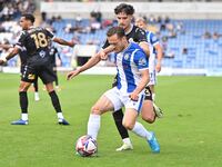 Jack Payne (10 Colchester United) is challenged by Besart Topalloi (23 Bromley) during the Sky Bet League 2 match between Colchester United...