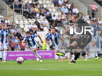 Michael Cheek (9 Bromley) scores from the penalty spot to make it 0-1 during the Sky Bet League 2 match between Colchester United and Bromle...