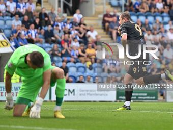 Michael Cheek (9 Bromley) celebrates after scoring the team's first goal from the penalty spot during the Sky Bet League 2 match between Col...