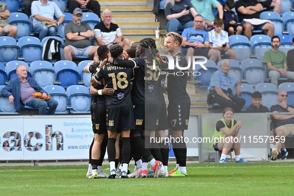 Bromley players celebrate Michael Cheek's first goal from the penalty spot during the Sky Bet League 2 match between Colchester United and B...