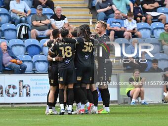 Bromley players celebrate Michael Cheek's first goal from the penalty spot during the Sky Bet League 2 match between Colchester United and B...