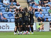 Bromley players celebrate Michael Cheek's first goal from the penalty spot during the Sky Bet League 2 match between Colchester United and B...