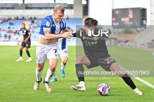 Besart Topalloi (23 Bromley) is challenged by Harry Anderson (7 Colchester United) during the Sky Bet League 2 match between Colchester Unit...