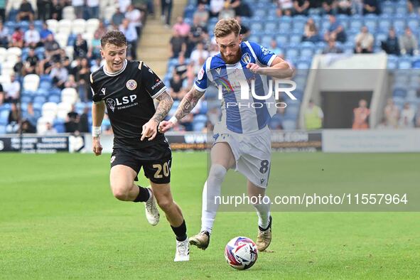 Teddy Bishop (8 Colchester United) is challenged by Jude Arthurs (20 Bromley) during the Sky Bet League 2 match between Colchester United an...