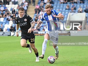 Teddy Bishop (8 Colchester United) is challenged by Jude Arthurs (20 Bromley) during the Sky Bet League 2 match between Colchester United an...