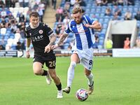 Teddy Bishop (8 Colchester United) is challenged by Jude Arthurs (20 Bromley) during the Sky Bet League 2 match between Colchester United an...