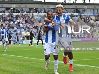 Owura Edwards (21 Colchester United) celebrates his goal with Lyle Taylor (33 Colchester United) during the Sky Bet League 2 match between C...