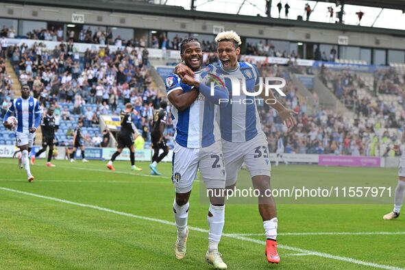 Owura Edwards (21 Colchester United) celebrates with Lyle Taylor (33 Colchester United) his first goal 1-1 during the Sky Bet League 2 match...