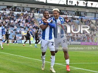 Owura Edwards (21 Colchester United) celebrates with Lyle Taylor (33 Colchester United) his first goal 1-1 during the Sky Bet League 2 match...