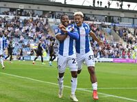 Owura Edwards (21 Colchester United) celebrates with Lyle Taylor (33 Colchester United) his first goal 1-1 during the Sky Bet League 2 match...