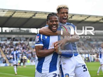 Owura Edwards (21, Colchester United) celebrates with Lyle Taylor (33, Colchester United) his first goal, making the score 1-1, during the S...