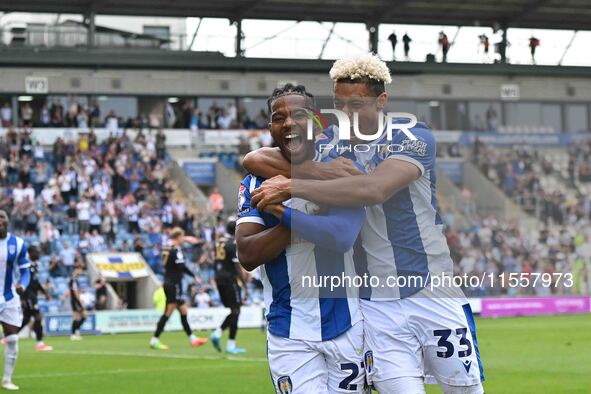 Owura Edwards (21 Colchester United) celebrates his goal with Lyle Taylor (33 Colchester United) during the Sky Bet League 2 match between C...