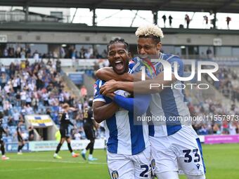 Owura Edwards (21 Colchester United) celebrates his goal with Lyle Taylor (33 Colchester United) during the Sky Bet League 2 match between C...