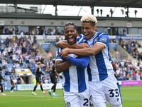 Owura Edwards (21 Colchester United) celebrates his goal with Lyle Taylor (33 Colchester United) during the Sky Bet League 2 match between C...