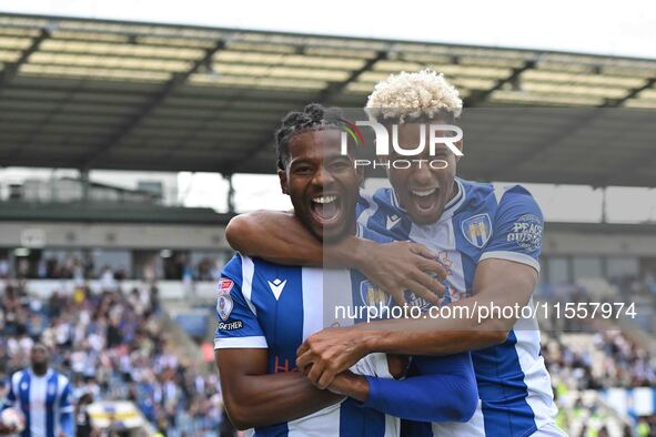 Owura Edwards (21 Colchester United) celebrates his goal with Lyle Taylor (33 Colchester United) during the Sky Bet League 2 match between C...