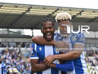 Owura Edwards (21 Colchester United) celebrates his goal with Lyle Taylor (33 Colchester United) during the Sky Bet League 2 match between C...