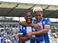 Owura Edwards (21 Colchester United) celebrates his goal with Lyle Taylor (33 Colchester United) during the Sky Bet League 2 match between C...