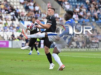 Deji Elerewe (3 Bromley) challenges Samson Tovide (9 Colchester United) during the Sky Bet League 2 match between Colchester United and Brom...