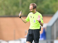 Referee Sam Purkiss holds his hands up during the Sky Bet League 2 match between Colchester United and Bromley at the Weston Homes Community...