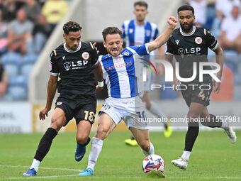 Jack Payne (10 Colchester United) is challenged by Corey Whitely (18 Bromley) during the Sky Bet League 2 match between Colchester United an...