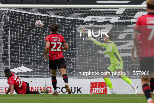 Callum Hendry finds the back of the net for Milton Keynes Dons to take the lead, making it 1-0 against Walsall, during the first half of the...