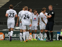 Callum Hendry celebrates with teammates after scoring for Milton Keynes Dons to take the lead, making it 1-0 against Walsall, during the fir...