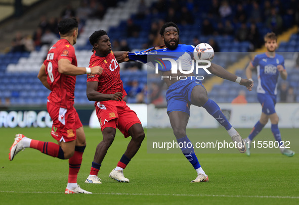 Emmanuel Monthe of Oldham Athletic Association Football Club tussles with Aribim Pepple of Southend United Football Club during the Vanarama...