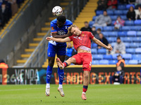 Emmanuel Monthe of Oldham Athletic Association Football Club tussles with Gus Scott-Morriss of Southend United Football Club during the Vana...